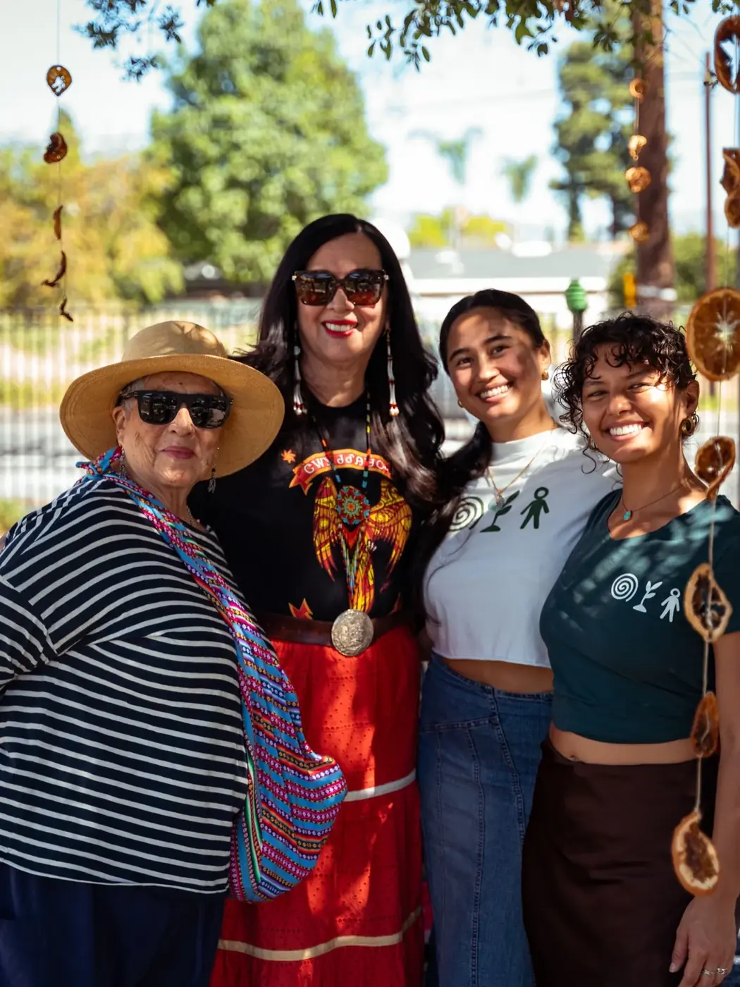 Community members smiling together at an outdoor event
